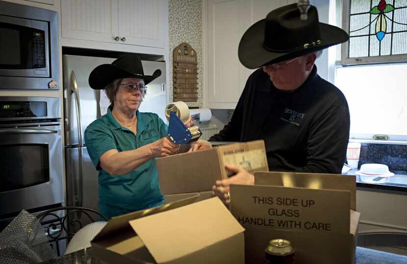 

Gale and Harold Green package a shipment of sauce at their home. The Greens picked up 31...