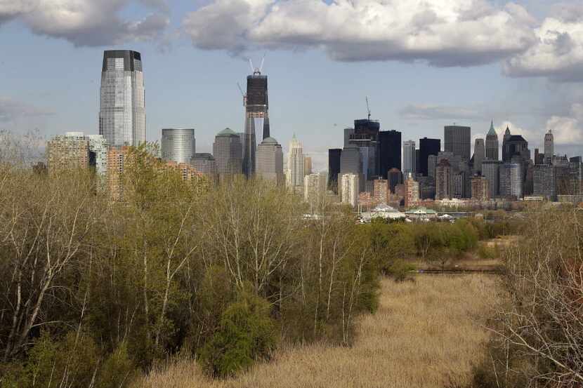 This photo taken Thursday, April 12, 2012, shows the Jersey City and New York City skylines...