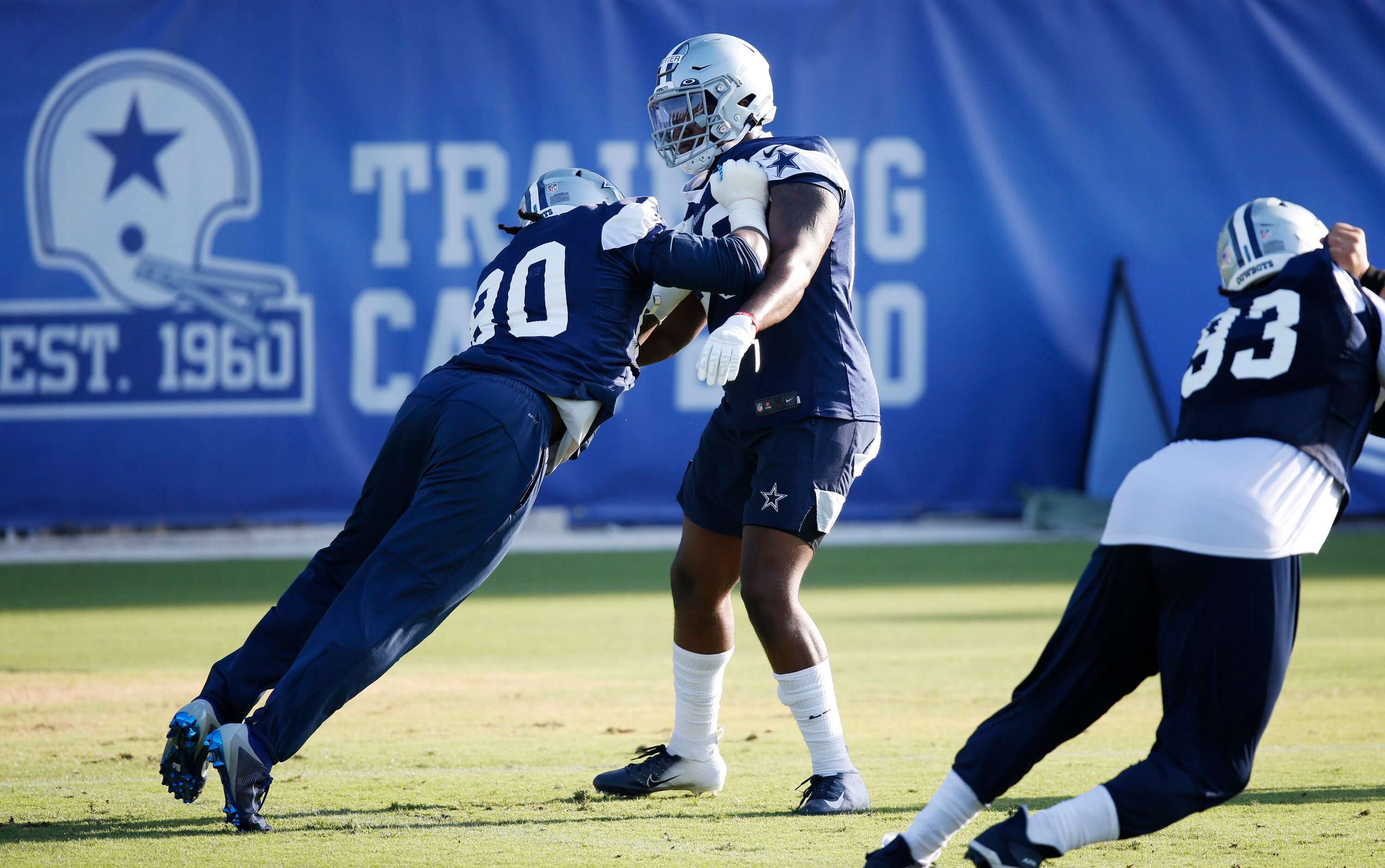 Dallas Cowboys defensive end DeMarcus Lawrence (90) and Dallas Cowboys defensive end...