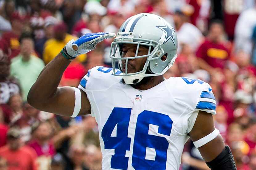Dallas Cowboys running back Alfred Morris salutes the crowd after scoring on a 4-yard run...
