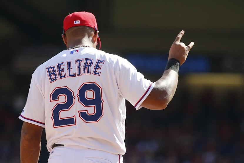 Texas Rangers third baseman Adrian Beltre (29) signals after the second out in the top of...