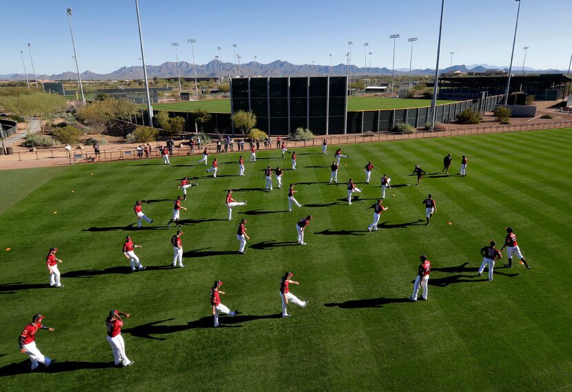 Arizona Diamondbacks players stretch during spring training baseball workouts Thursday. 