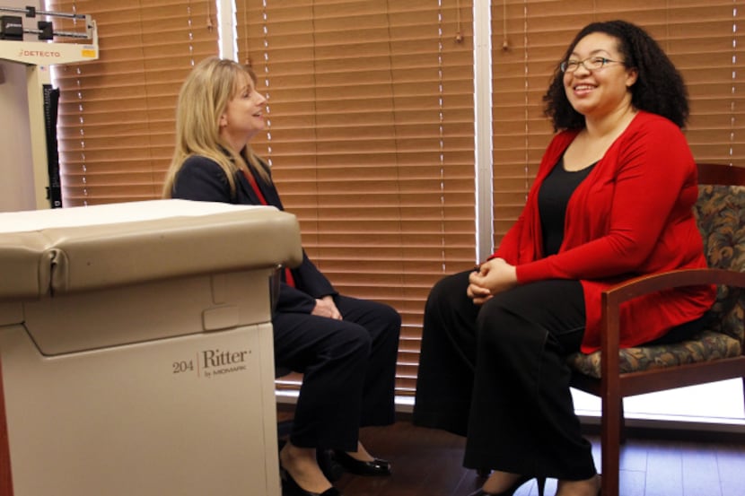 Nurse Ann Bowers (left), a care coordinator, talks with new patient Leslie Jasper at a...