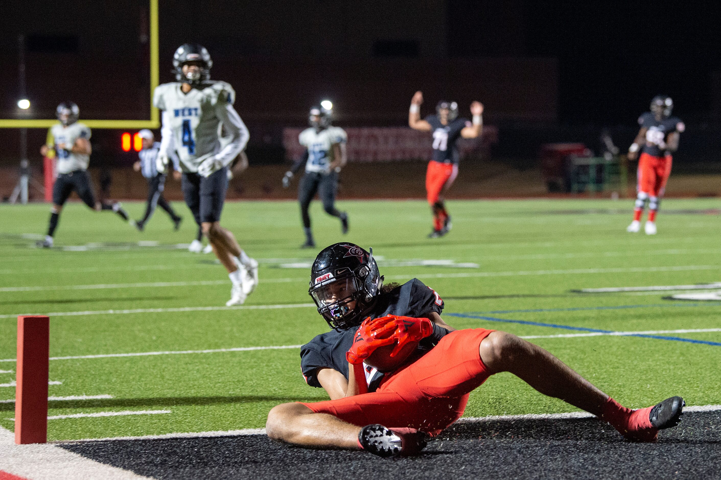 Coppell junior wide receiver Anthony Black (2) comes down with a touchdown reception against...