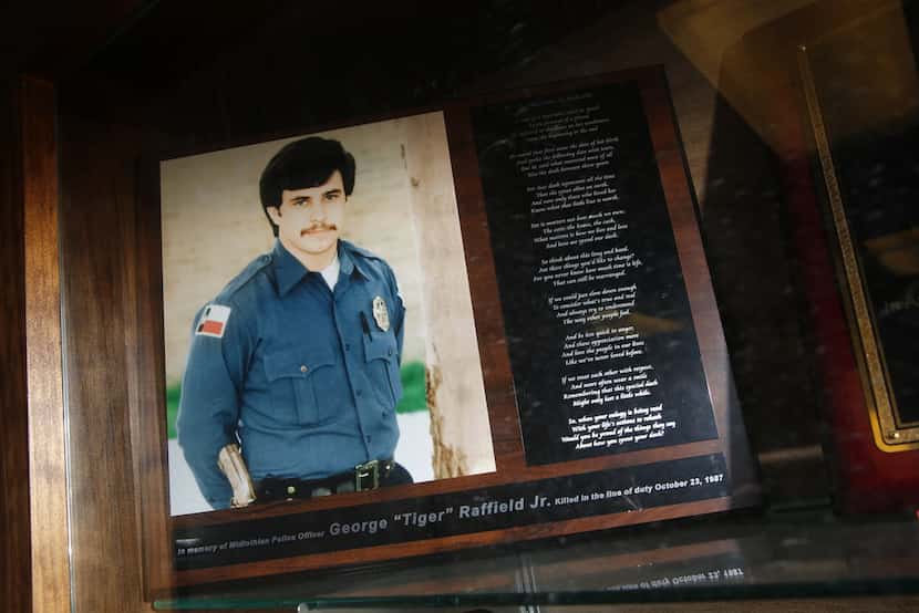 A plaque to remember George Raffield Jr. is in the lobby of the Midlothian Police...