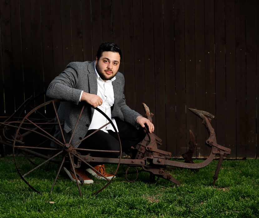 Verdigris Ensemble artistic director Sam Brukhman poses with a plow that will be installed...