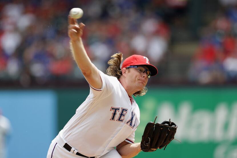 ARLINGTON, TX - AUGUST 14:  A.J. Griffin #64 of the Texas Rangers throws against the Detroit...