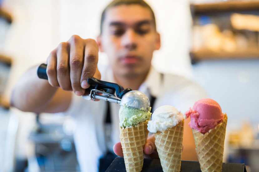 Chef Aldo Sandoval serves a flight of ice creams at Baldo's Ice Cream and Coffee on May 15,...