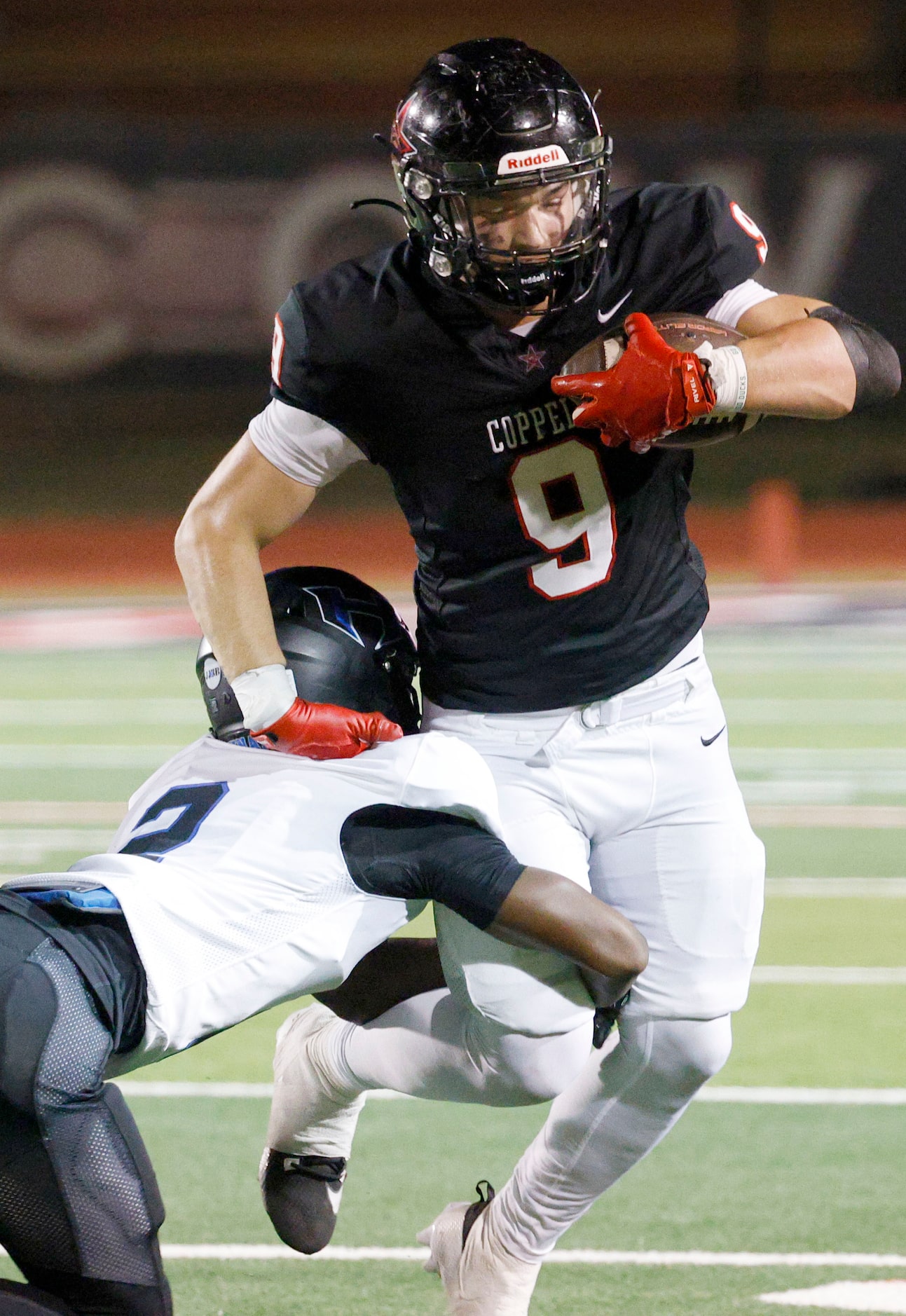 Coppell's Chris Searcy (9) is tackled by Hebron's Jeylin Cook (2) in the second half of a...