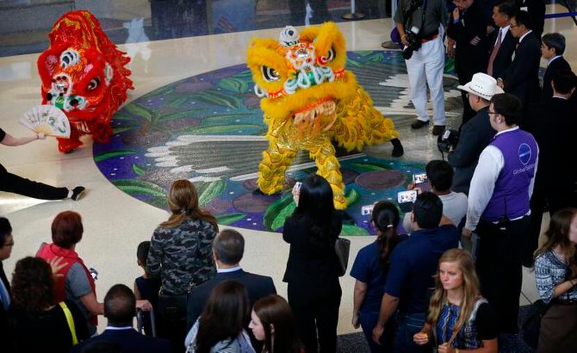 
Lion performers from Lee’s White Leopard Kung Fu School helped kick off American Airlines’...