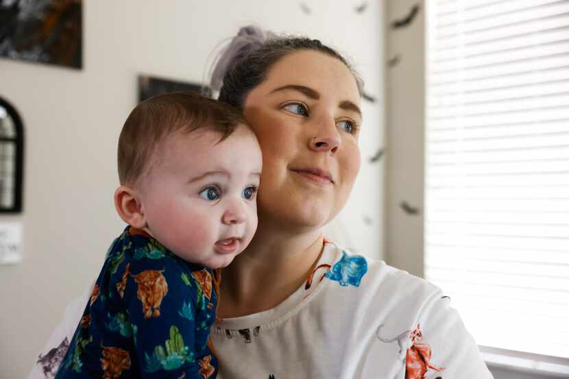 Sarah Brooke holds her 6-month-old son Solo Sorrells at their home in Foley on Monday, May...