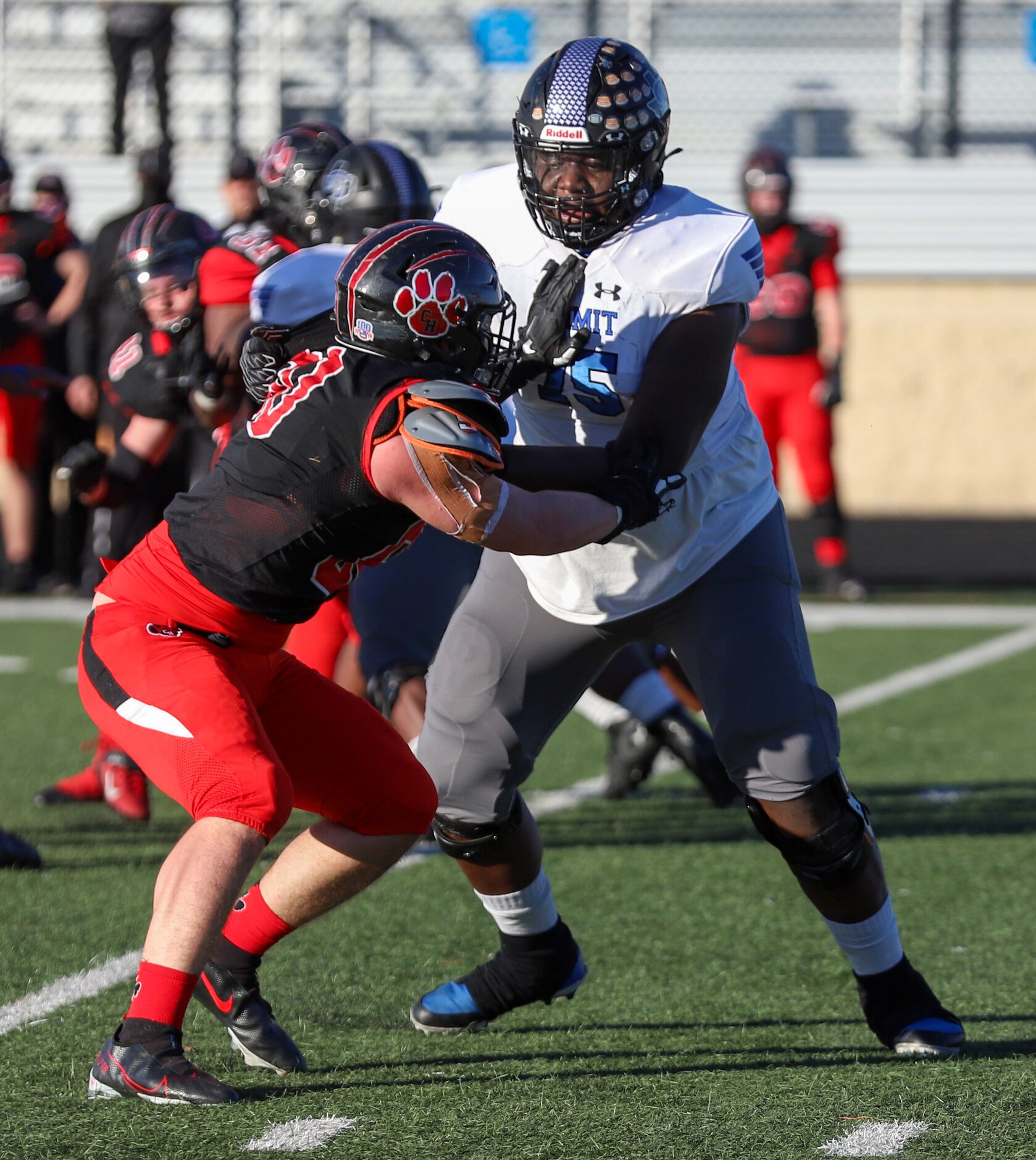 Mansfield Summit offensive lineman Colby Jackson (75) blocks Colleyville Heritage defensive...