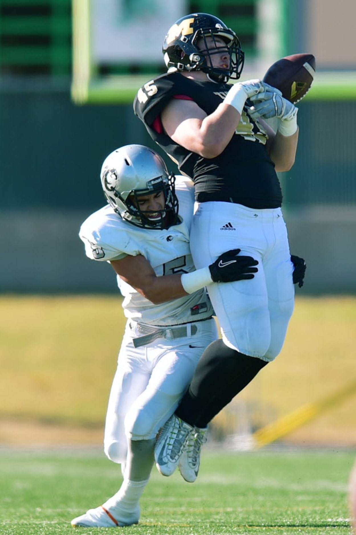 Guyer senior defensive back Brandon Daniel (5) causes Mansfield junior tight end Mason...