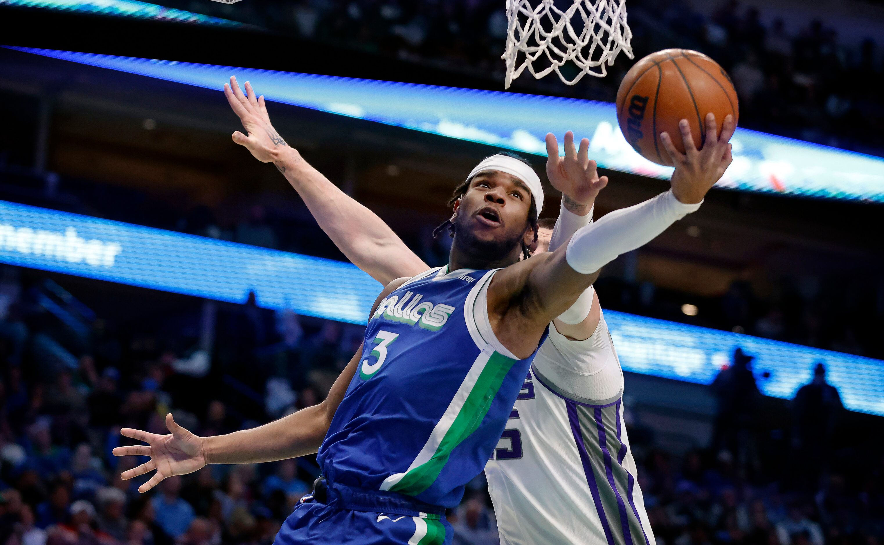 Dallas Mavericks guard Jaden Hardy (3) shoots a reverse layup against Sacramento Kings...