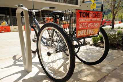 Deliveries on the bike will be made for customers up to 1.5 miles away from the Tom+Chee in...