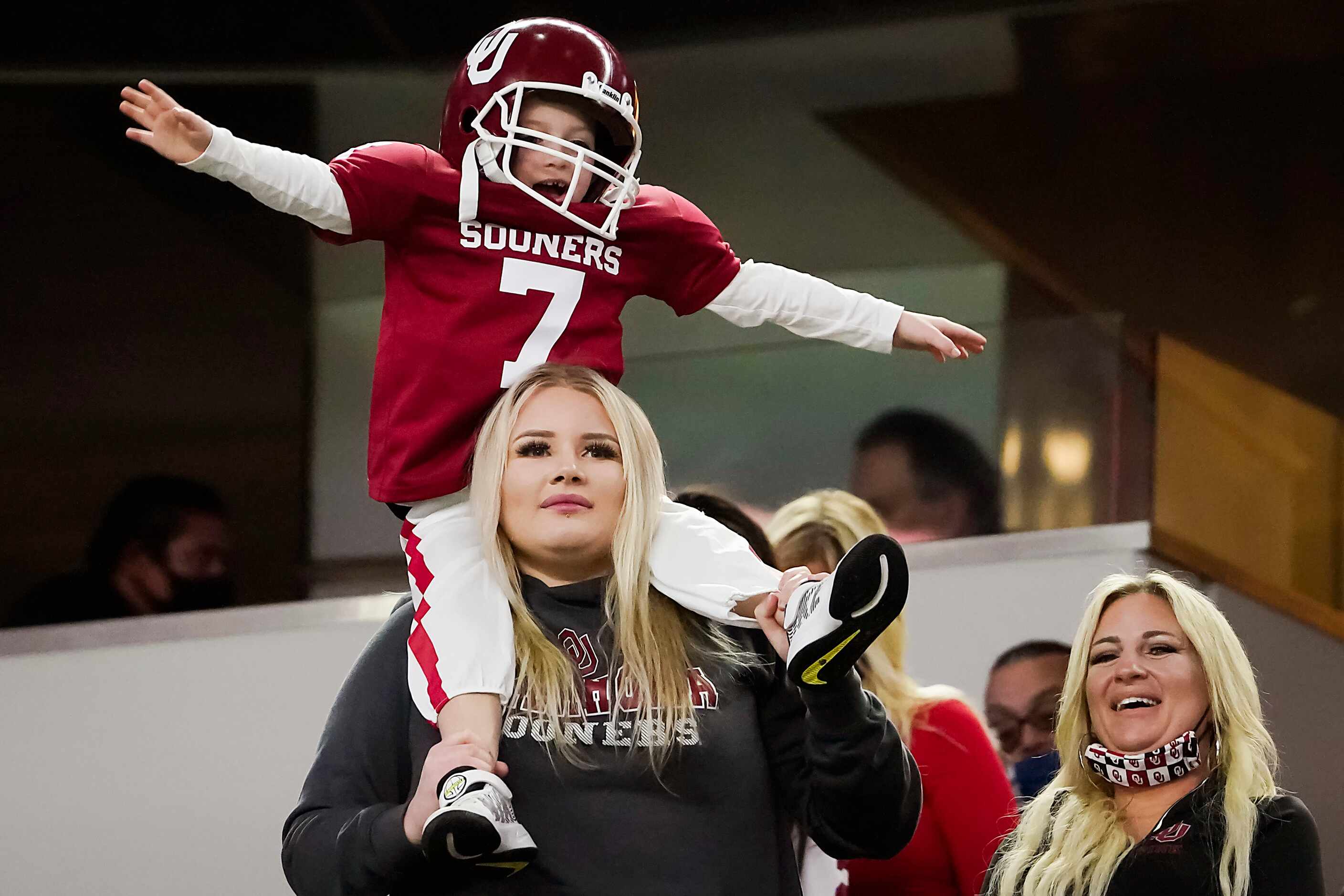 Oklahoma fans celebrate after a Sooners score during the second half of the Cotton Bowl...