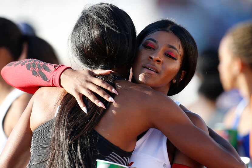 Mesquite Horn's Kaylor Harris, right, hugs Houston Lamar's Milan Young after competing in...