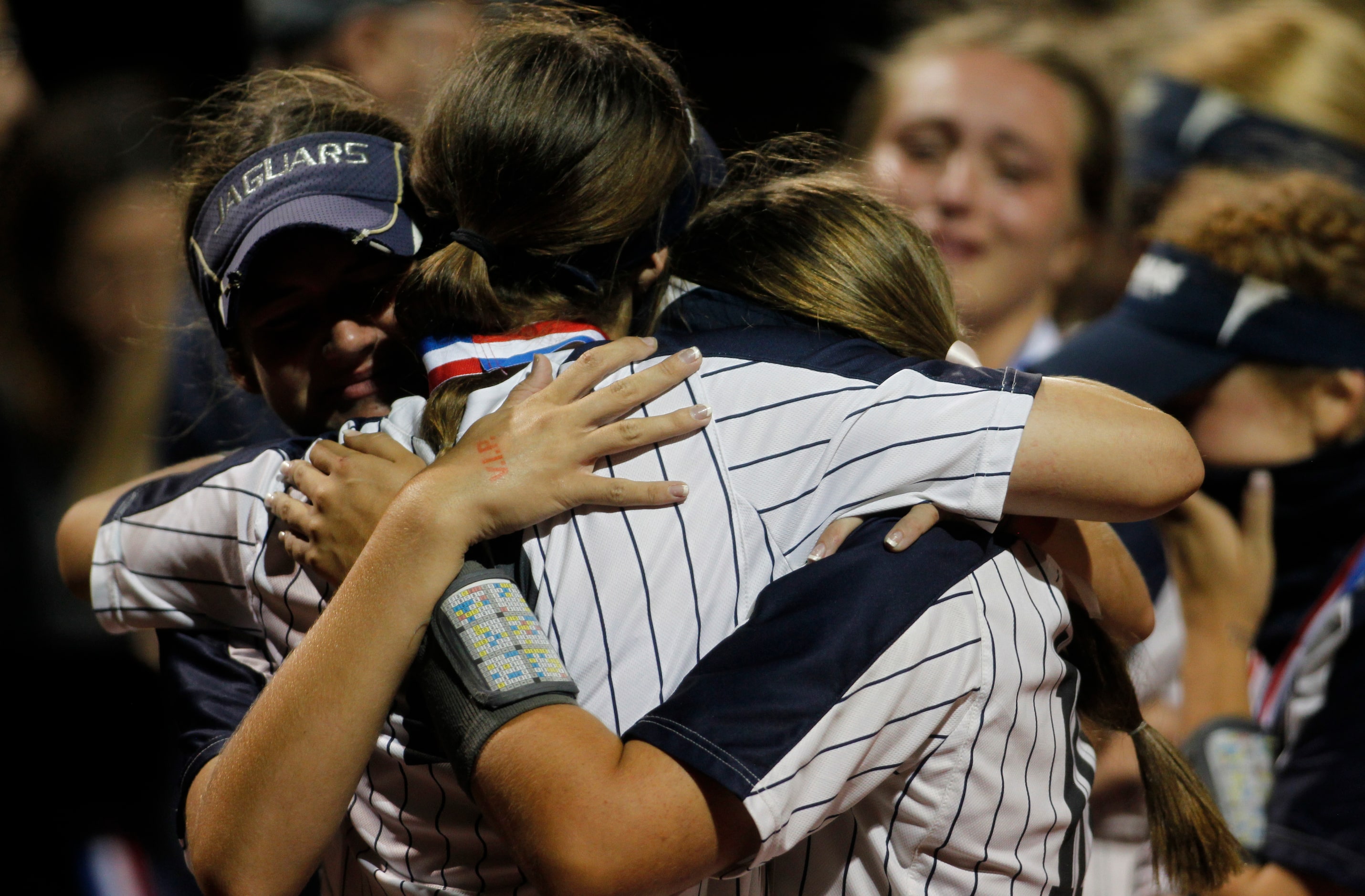 Flower Mound players console each other following their 2-0 loss to Deer Park. The two teams...