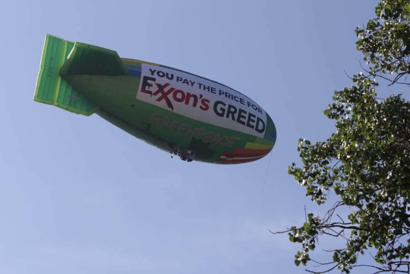 A Greenpeace blimp, protesting Exxon, headed back to Dallas Executive Airport after flying...
