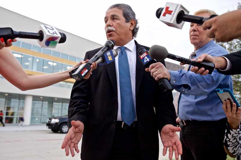 Dallas ISD Superintendent Michael Hinojosa speaks to the media before greeting students on...