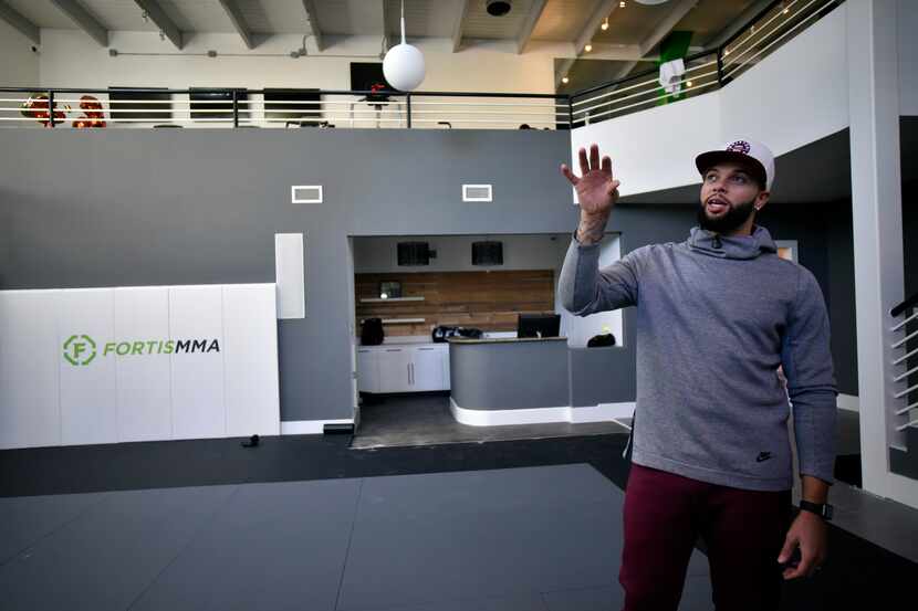 Dallas Mavericks point guard Deron Williams shows off the kick boxing room inside his...