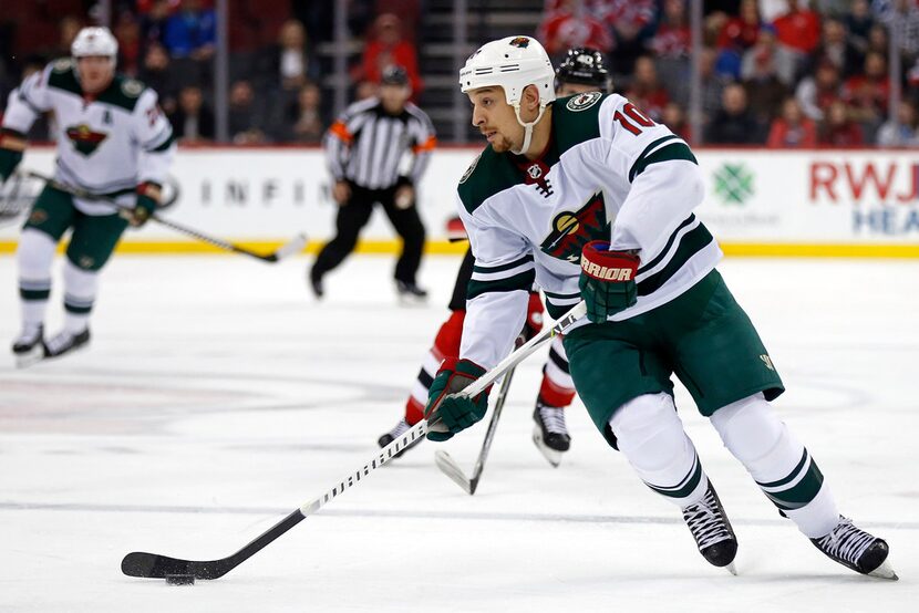 Minnesota Wild right wing Chris Stewart (10) looks to pass against the New Jersey Devils...