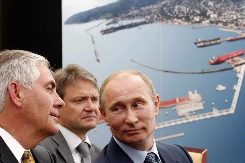 Russian President Vladimir Putin (right) and ExxonMobil CEO Rex Tillerson (left) attended a...