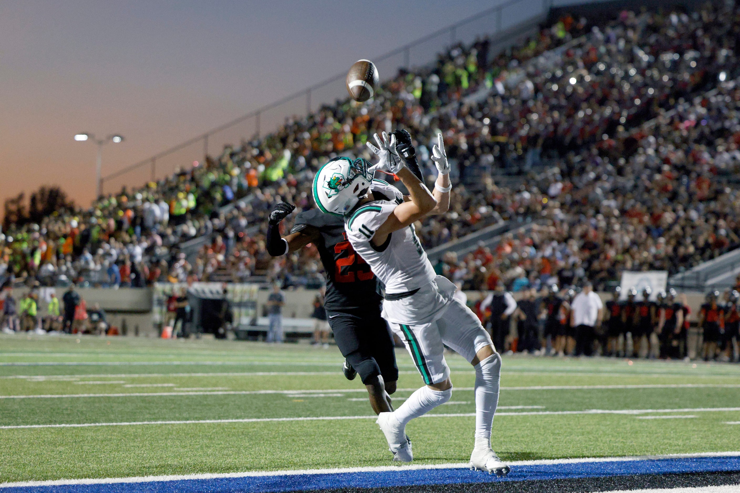 Southlake Carroll wide receiver Brock Boyd (11) catches a pass ahead of Euless Trinity...