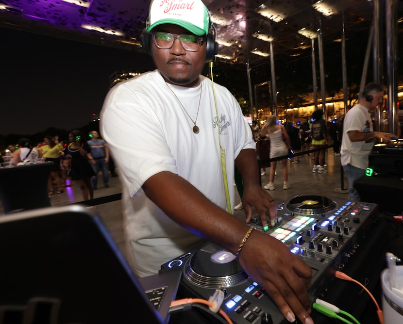 DJ Richy Smart spins some tunes during a silent disco at Klyde Warren Park in Dallas on...