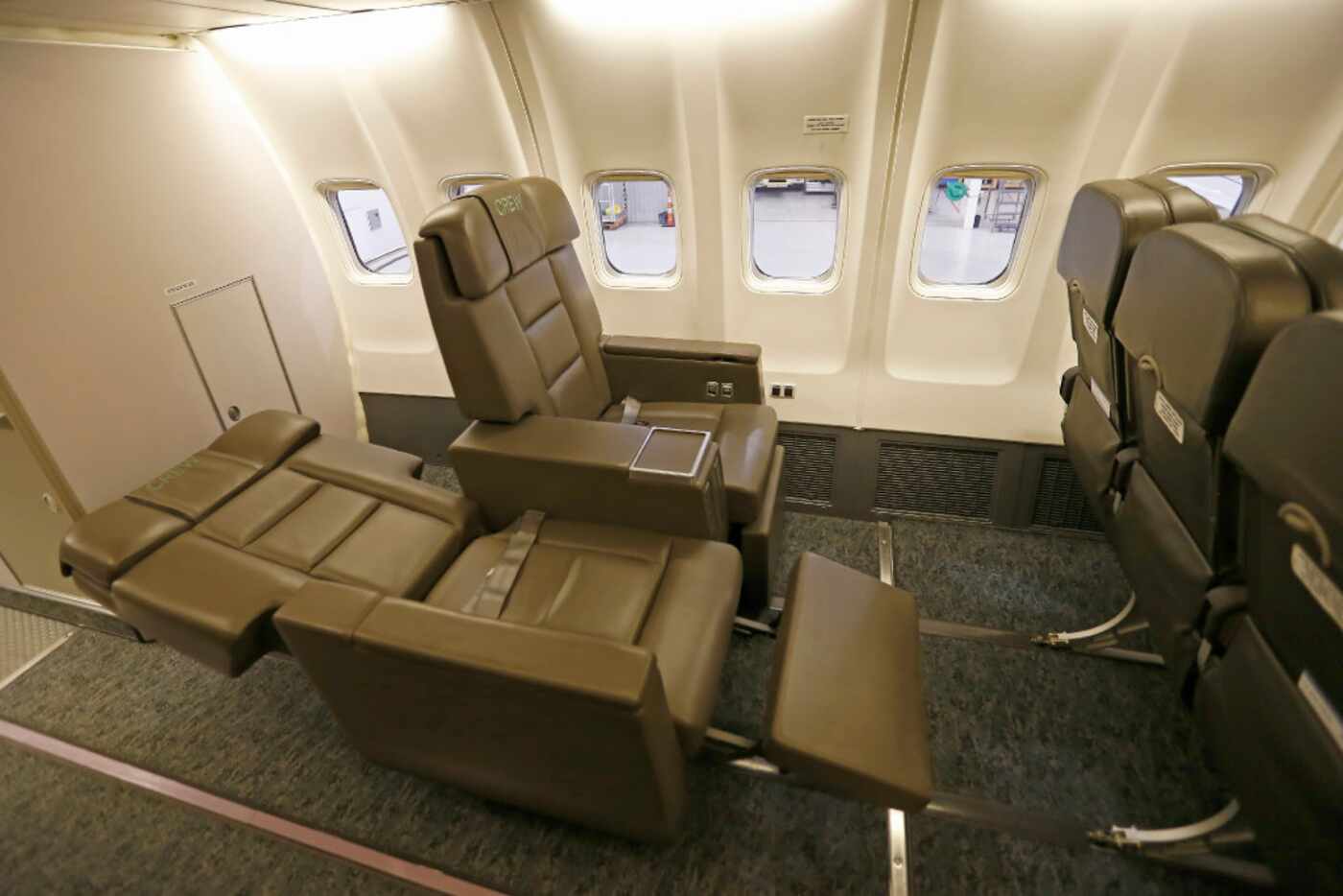Hillwood's plane sports 34 leather seats with plenty of legroom, a meeting area with tables...