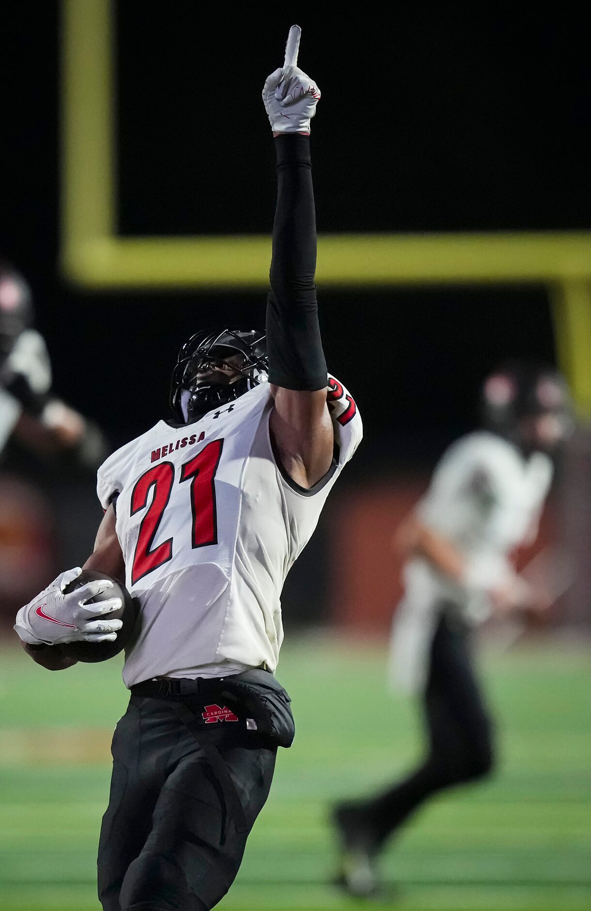 Melissa running back Nathan Adejokun (21) celebrates after scoring on a 4-yard touchdown run...