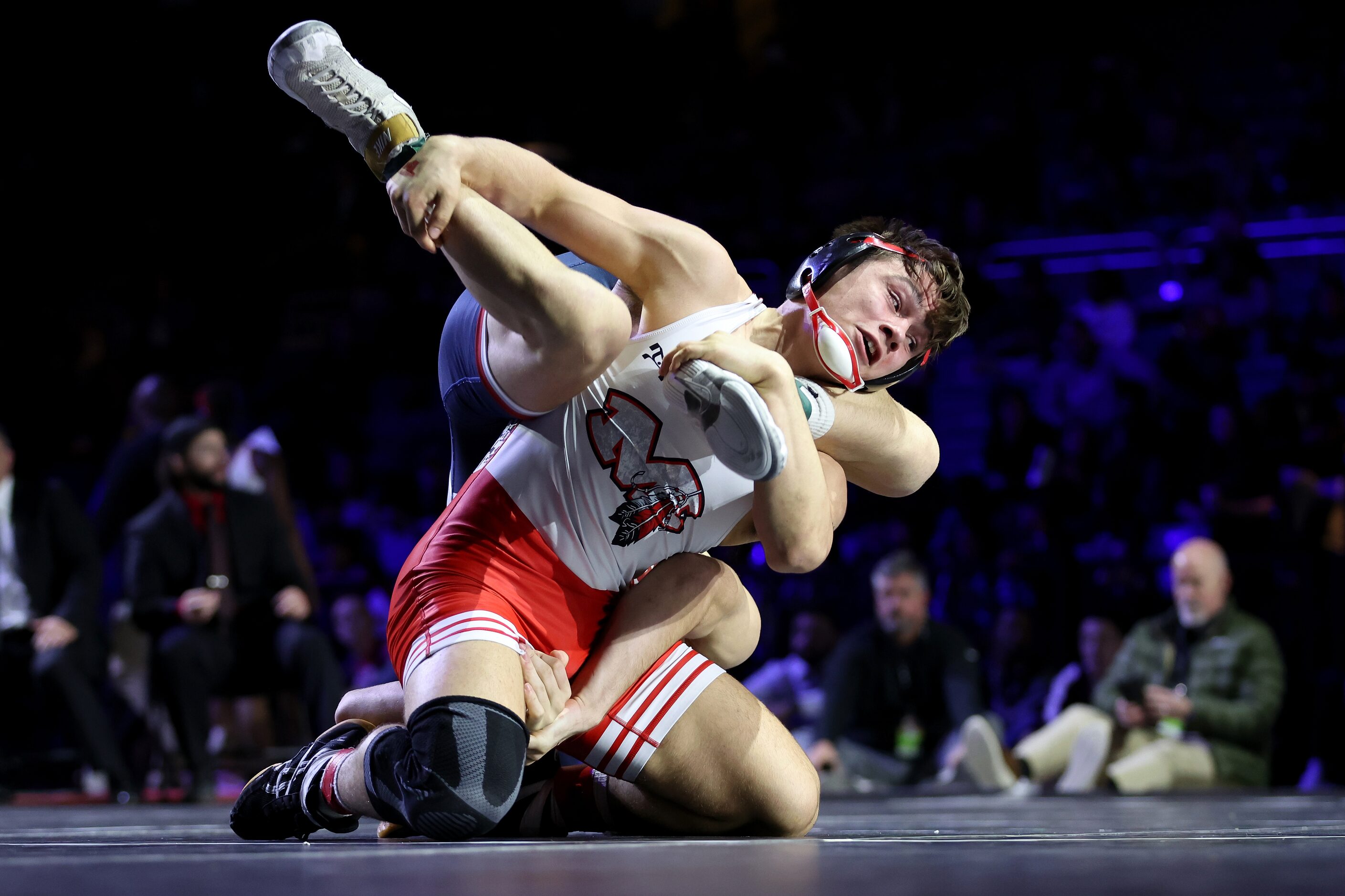 Grayson Carpenter of Arlington Martin (red) competes against Matteo Nikolov of Katy Tompkins...