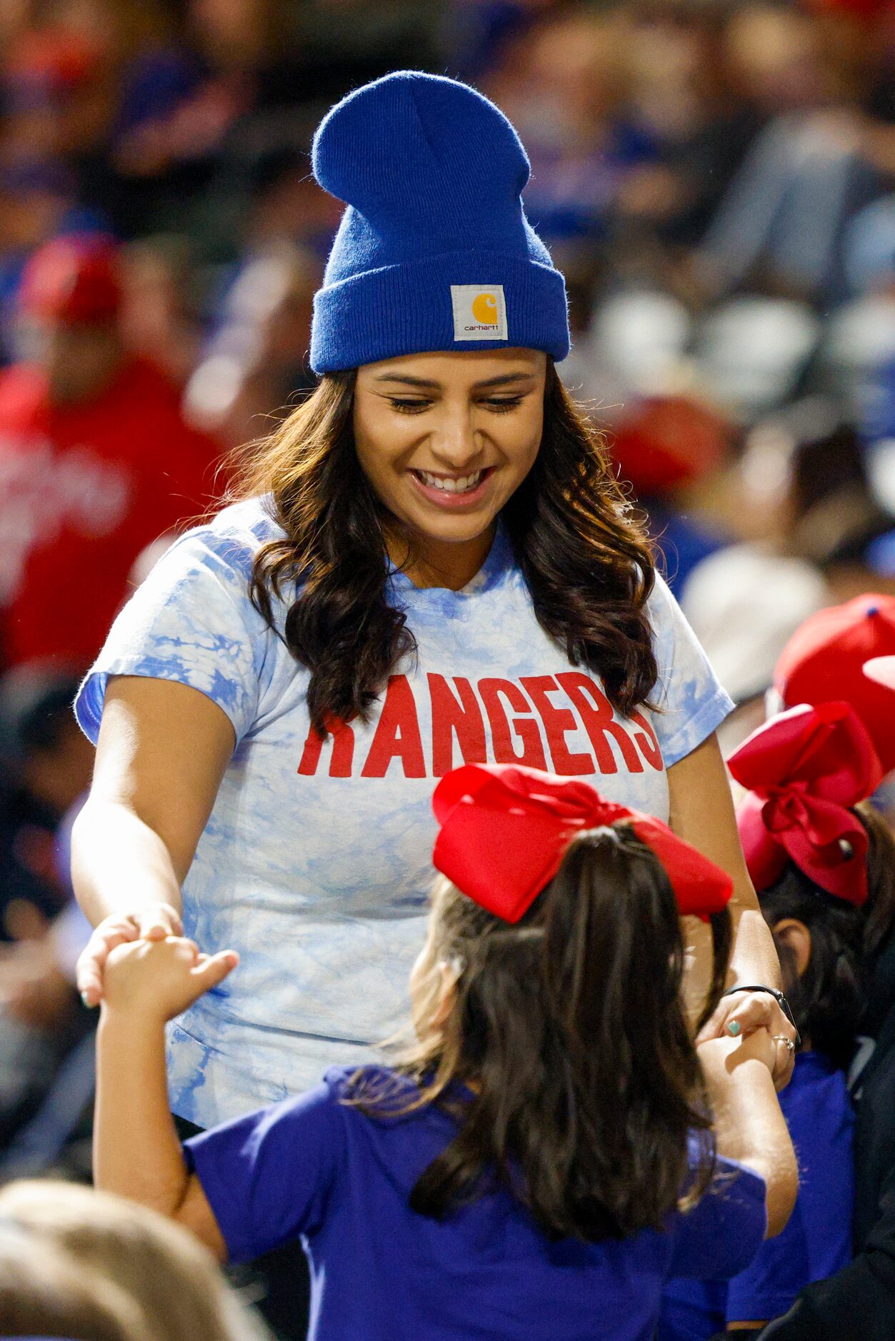 Andie Bazan dances to Selena with her daughter Riley Bazan, 5, during Game 3 of the World...