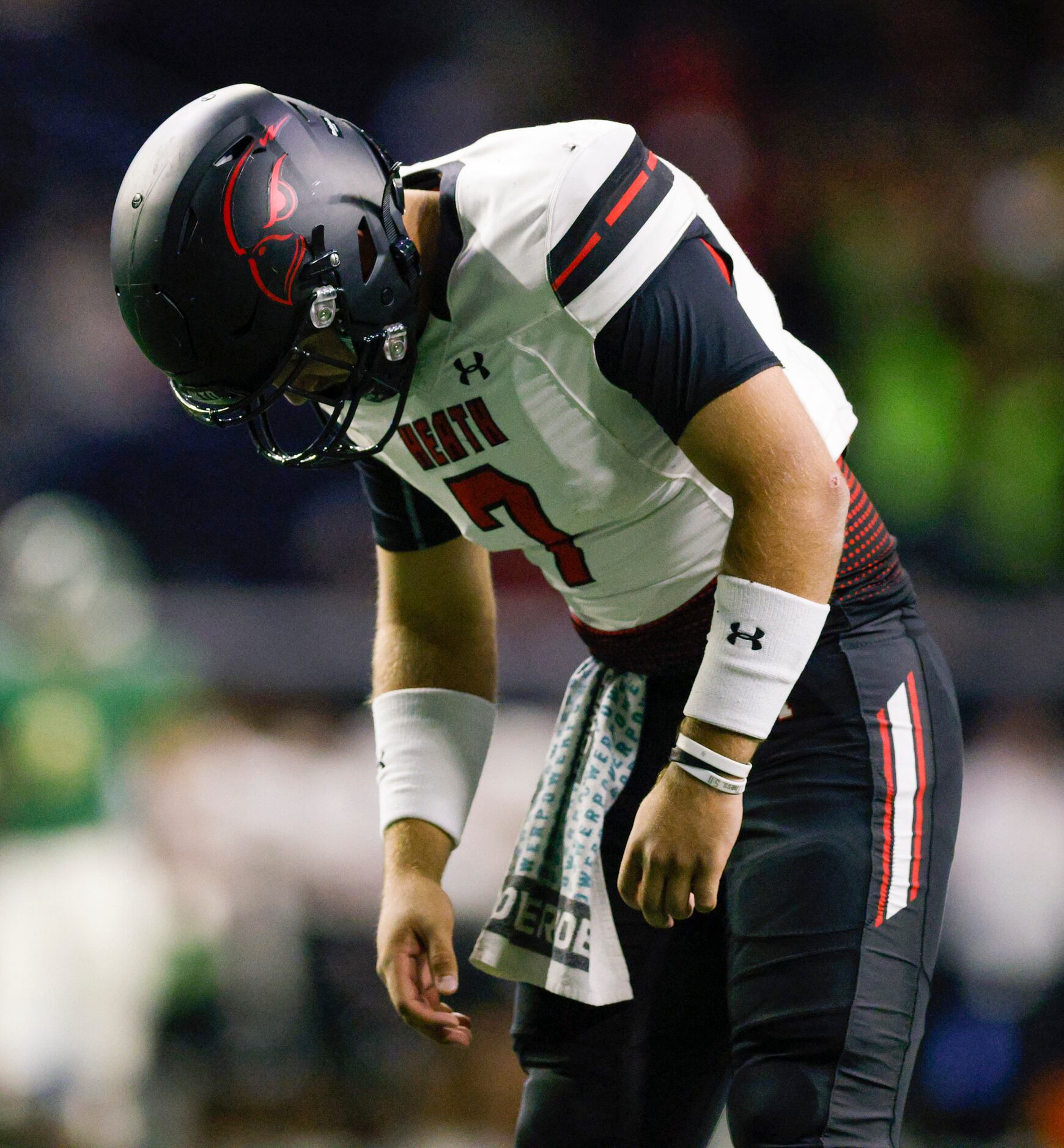 Rockwall-Heath quarterback Caleb Hoover (7) drops his head after throwing the ball away...