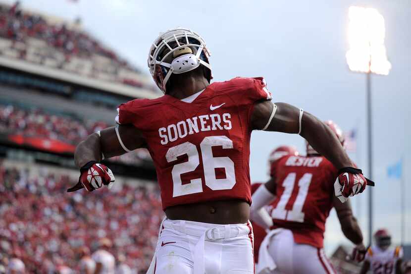 Oklahoma running back Damien Williams (26) celebrates a touchdown against the Iowa State...