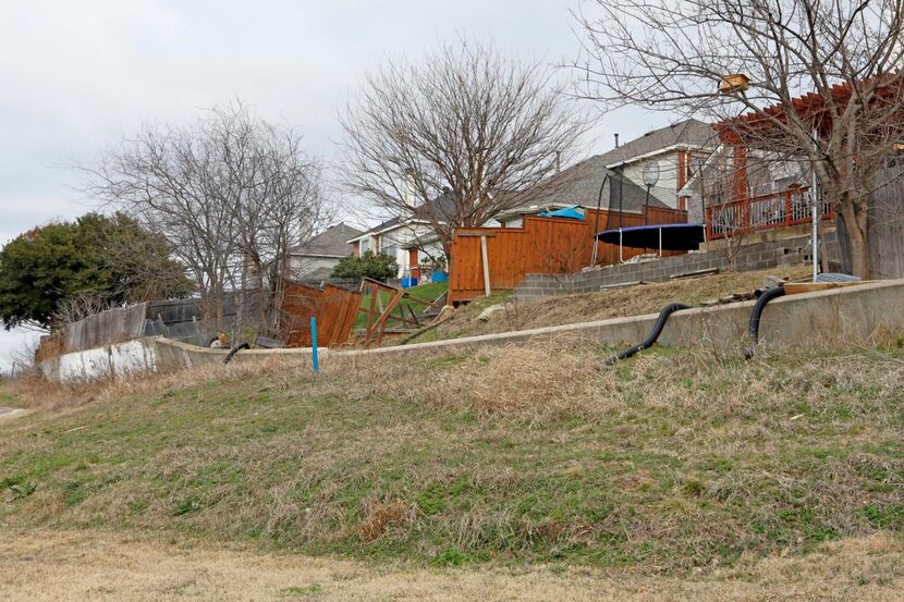 
A fence in the backyard of Milan Hamrla and Petra Chudejova has disintegrated as the creek...