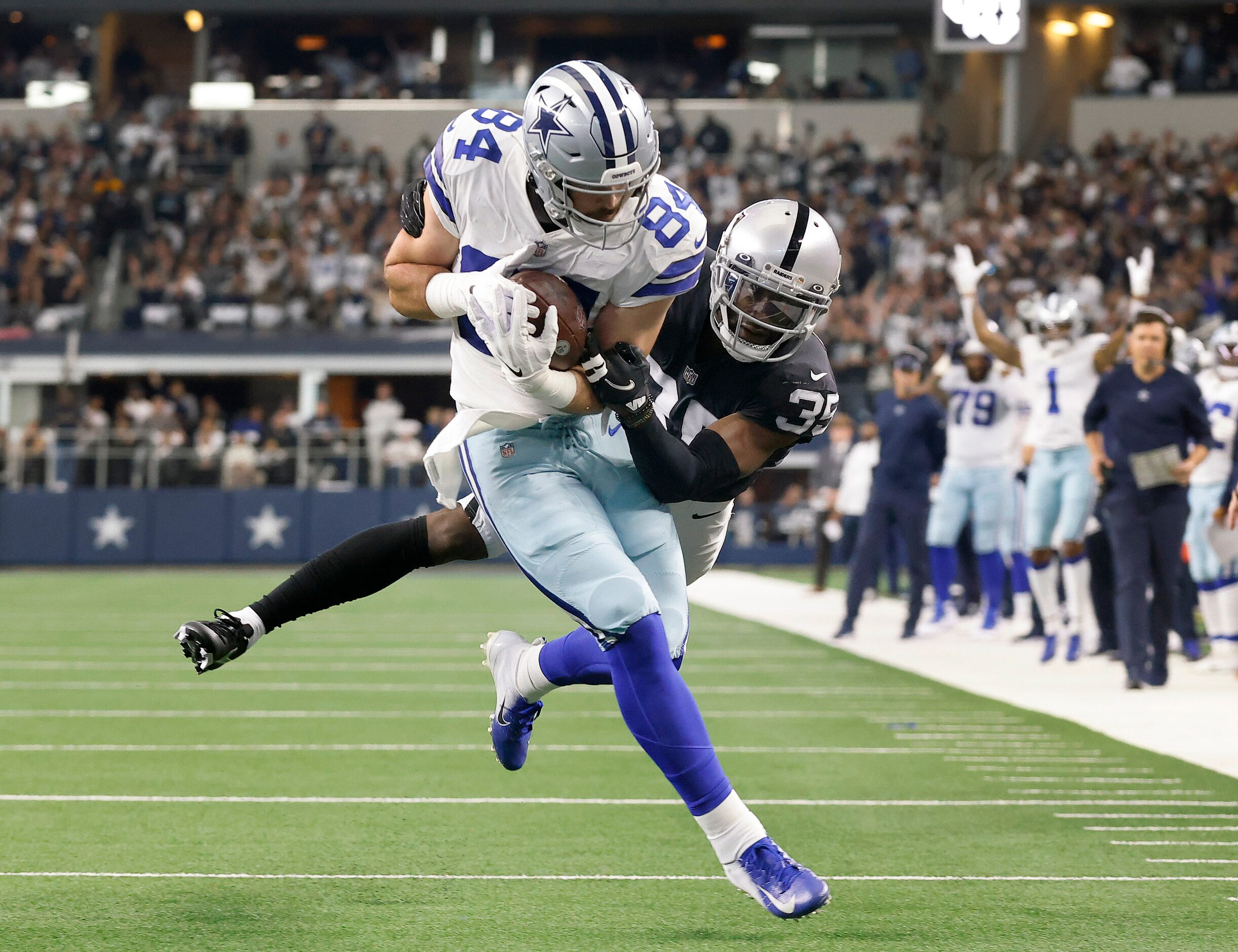 Dallas Cowboys tight end Sean McKeon (84) carries Las Vegas Raiders cornerback Brandon...