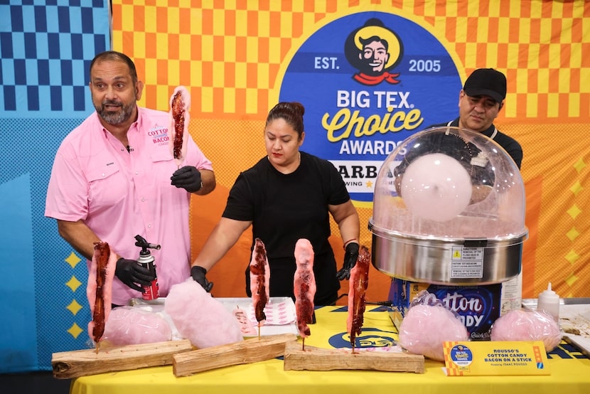 Isaac Rousso demonstrates a Cotton Candy Bacon on a Stick, one of the 10 Big Tex Choice...