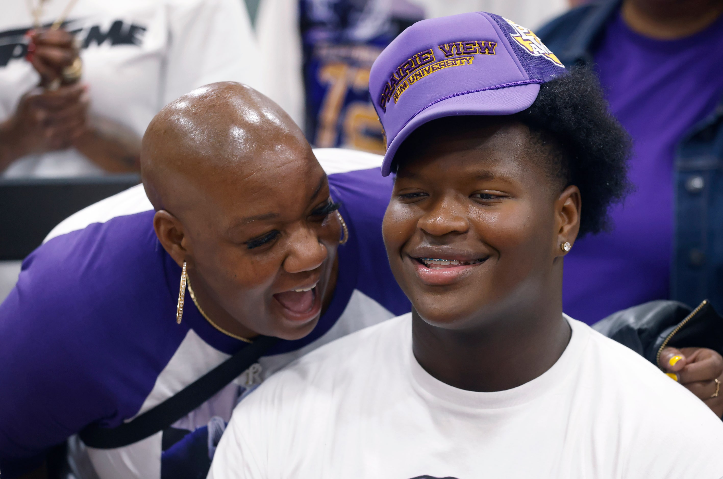 South Oak Cliff football player Xyler Myles (right) smiles as he had his photo taken with...