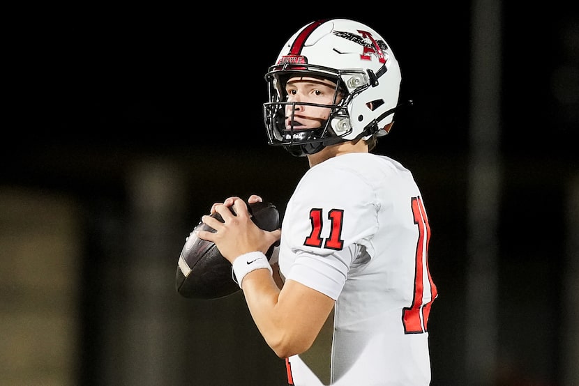 Argyle quarterback Maguire Gasperson (11) looks to pass during the first half of a District...