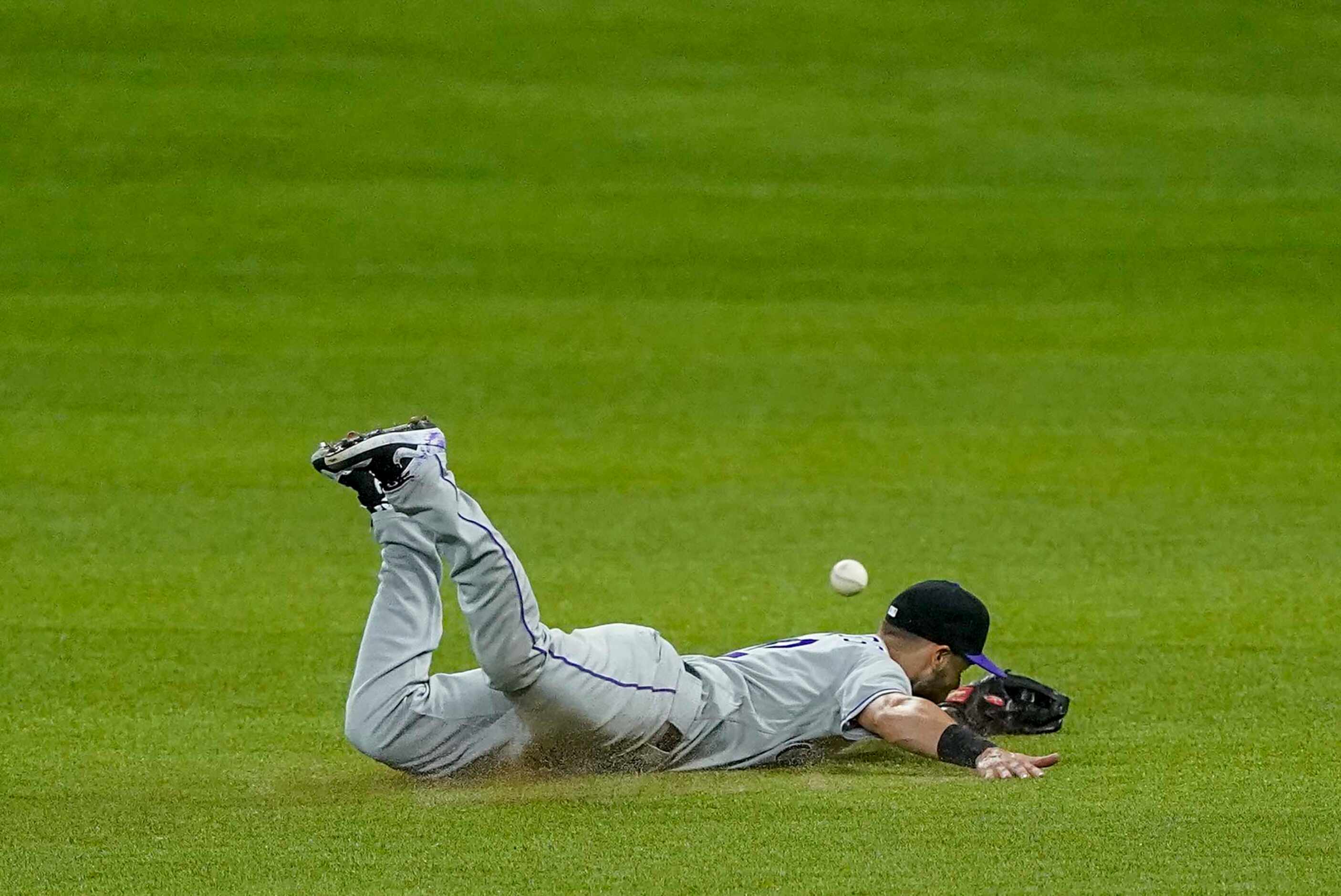 Colorado Rockies second baseman Chris Owings canÕt get to a single off the bat of Texas...