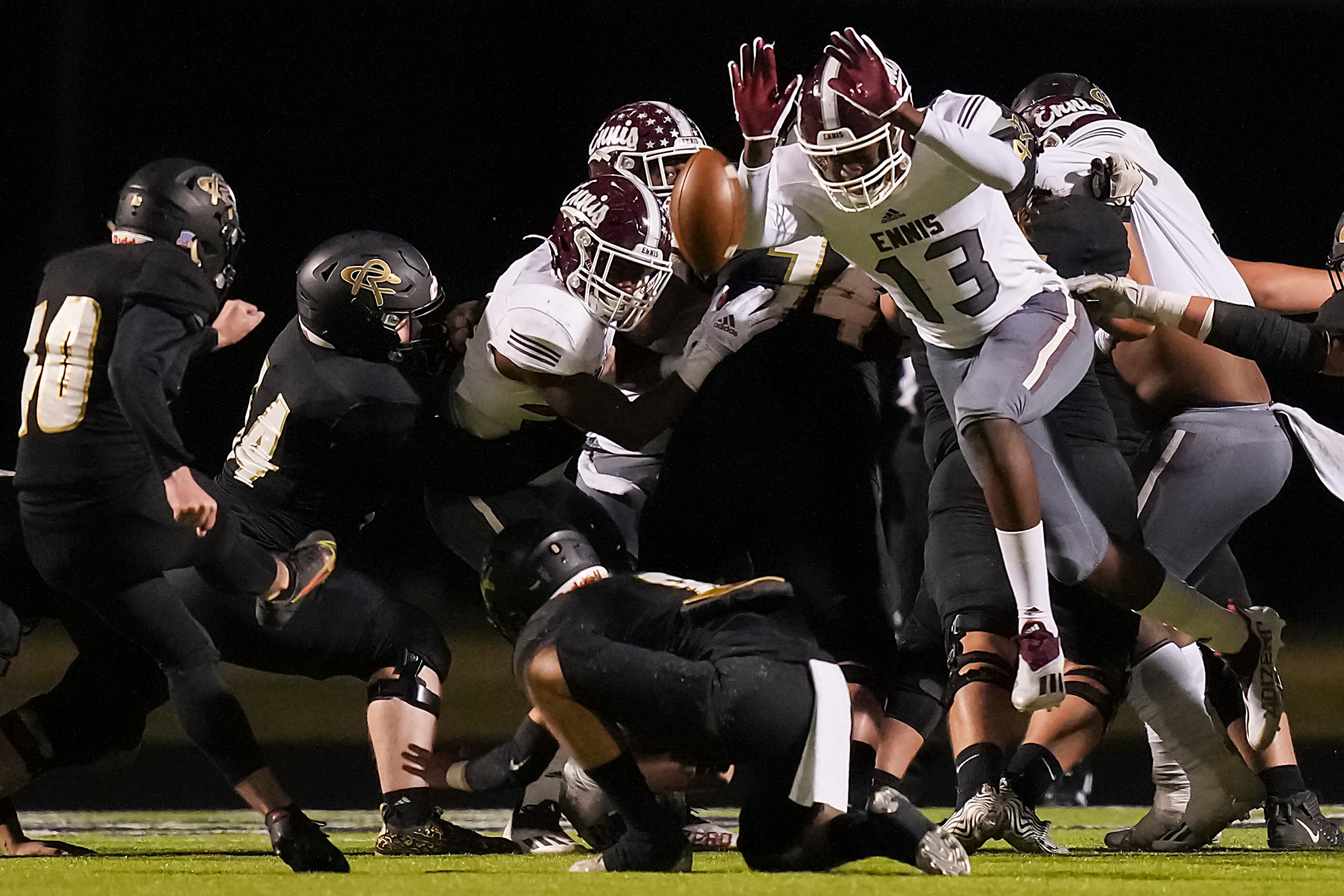 Ennis wide receiver Skylan Simmons (13) blocks an extra point attempt by Royse City kicker...