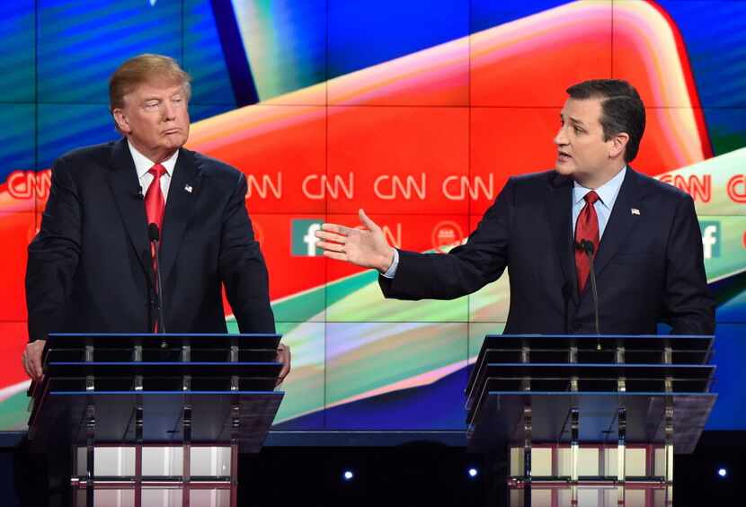 Sen. Ted Cruz speaks as Donald Trump looks on during the Republican Presidential Debate,...