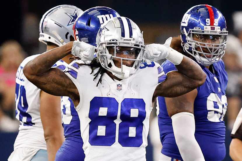 Dallas Cowboys wide receiver CeeDee Lamb (88) flexes after bowling over New York Giants...