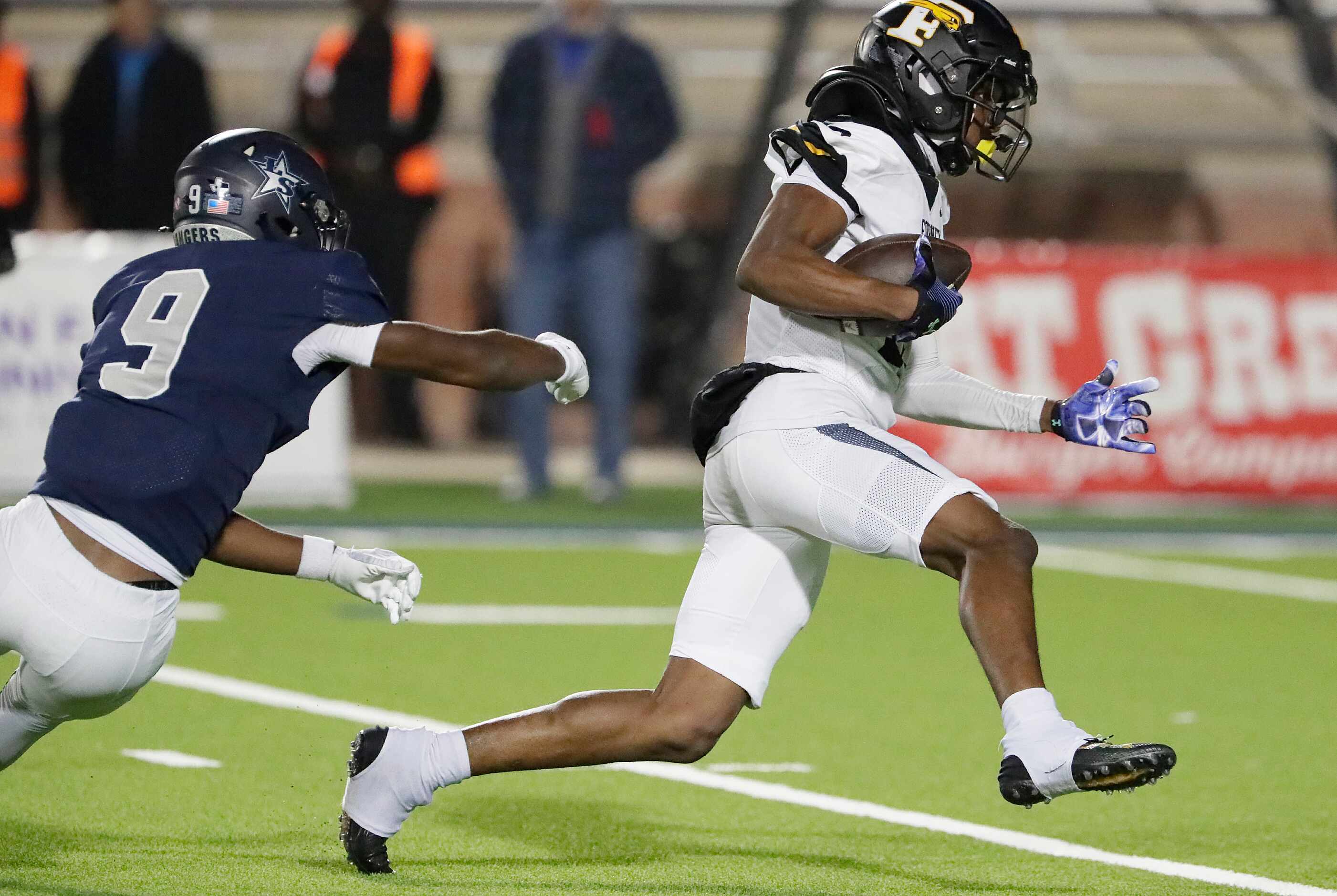 Forney High School wide receiver Imari Jehiel (13) breaks through the tackle attempt by Lone...
