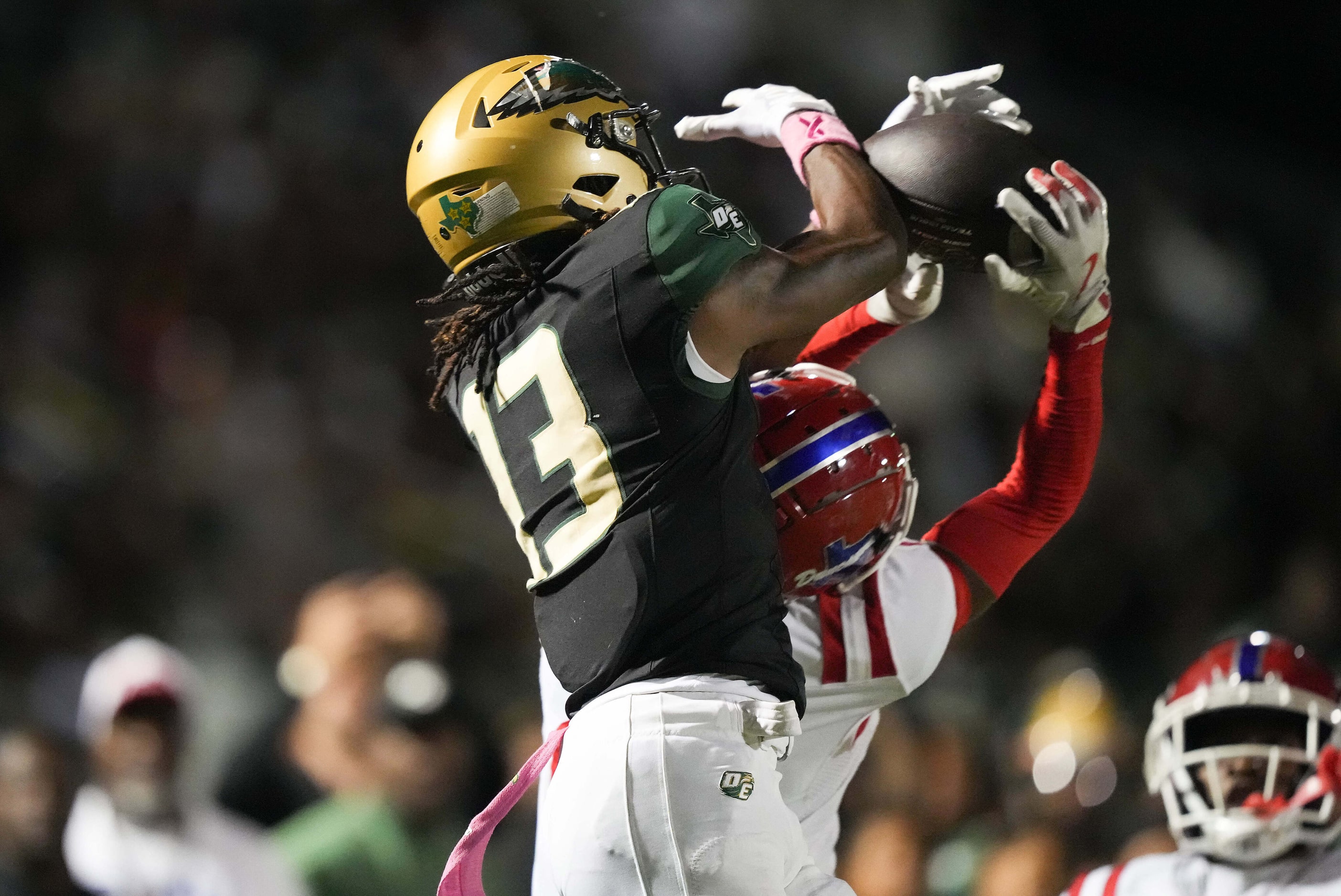 Duncanville defensive back Travyon Cherry (24) breaks up a pass intended for DeSoto wide...