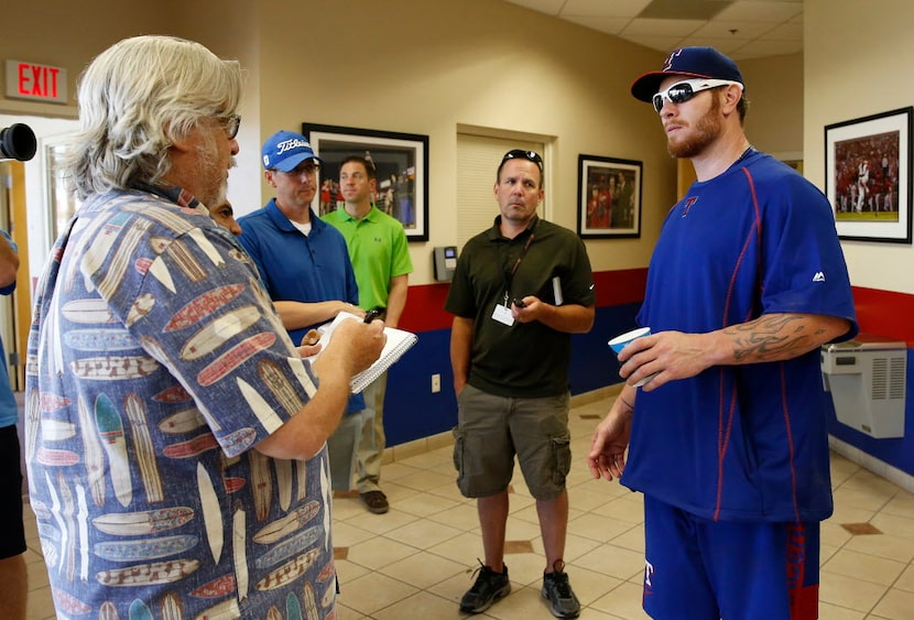 Apr 28, 2015; Surprise, AZ, USA; Josh Hamilton talks with the media after workouts at...