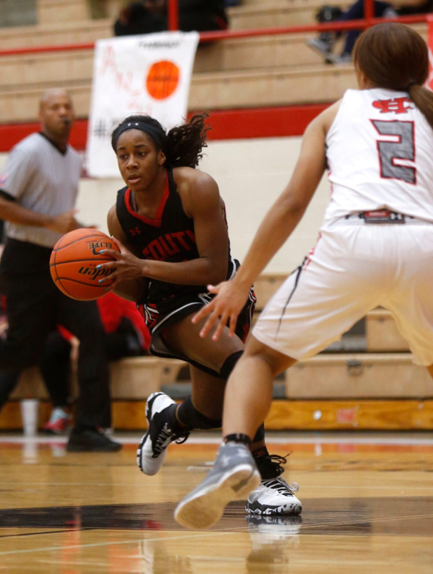 South Grand Prairie player Jessica Ray (1) drives the ball against Cedar Hill guard Kayla...