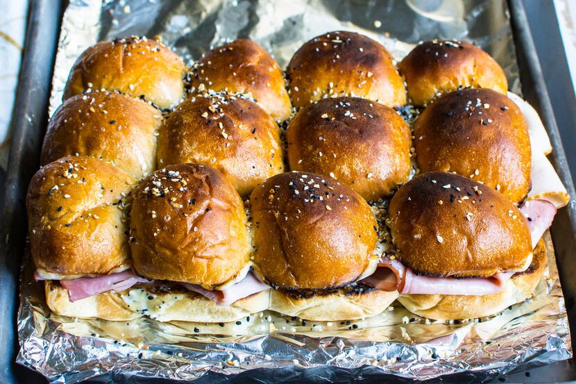 These sliders are topped with Everything But the Bagel Sesame Seasoning Blend from Trader...