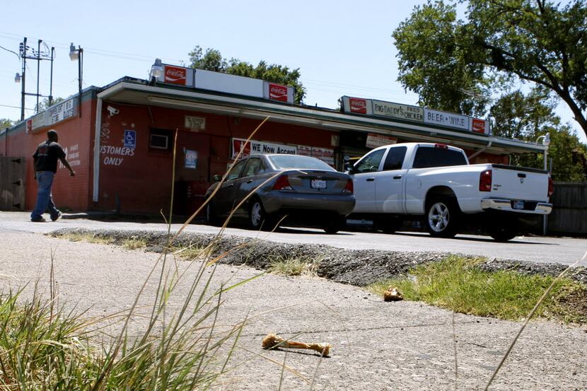  Chicken bones lie on the ground in South Dallas where access to fresh fruits and vegetables...